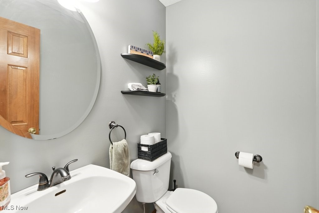 3385 Marsh Road Stow, OH 44224 - Photo 16 of 30 Half bathroom featuring a sink and toilet