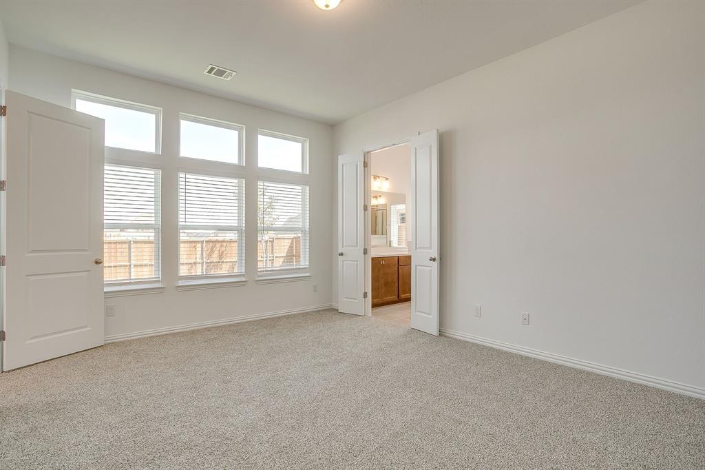 909 Schuberts Road Justin, TX 76247 - Photo 13 of 34 an empty room with windows