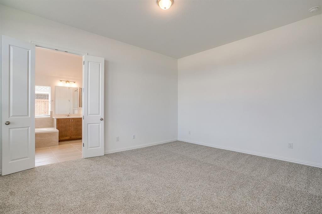 909 Schuberts Road Justin, TX 76247 - Photo 14 of 34 a view of a livingroom and a bathroom
