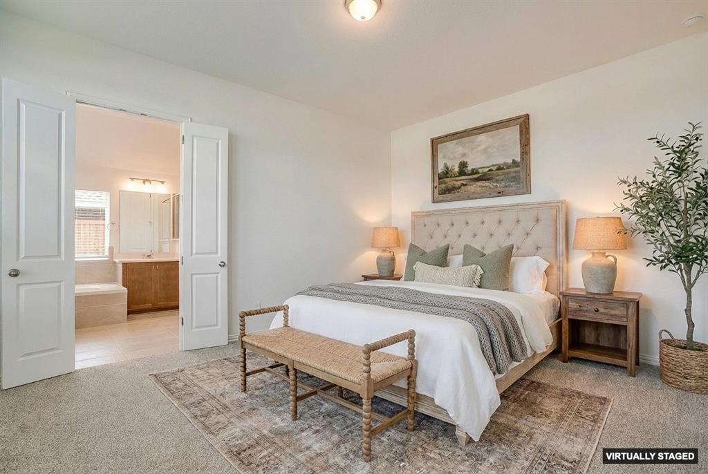 909 Schuberts Road Justin, TX 76247 - Photo 15 of 34 a bedroom with a bed a couch and a view of bedroom