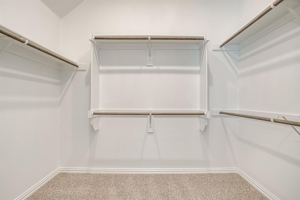 909 Schuberts Road Justin, TX 76247 - Photo 20 of 34 a view of an empty walk in closet