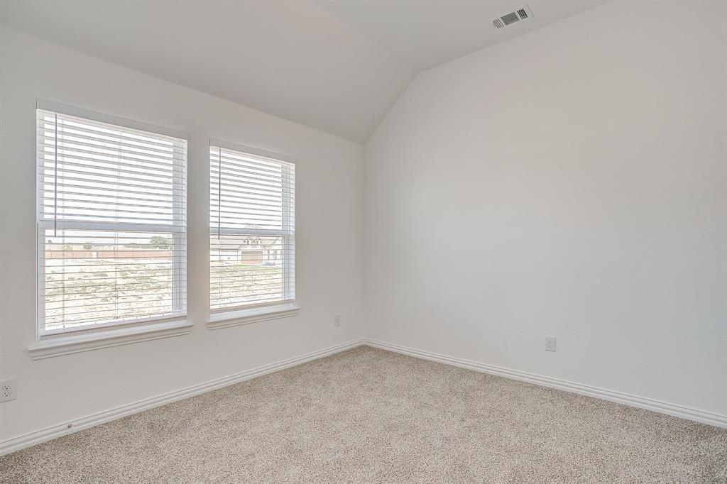 909 Schuberts Road Justin, TX 76247 - Photo 21 of 34 an empty room with a window