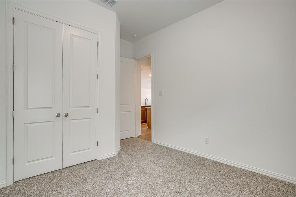 909 Schuberts Road Justin, TX 76247 - Photo 24 of 34 a view of an empty room and closet area