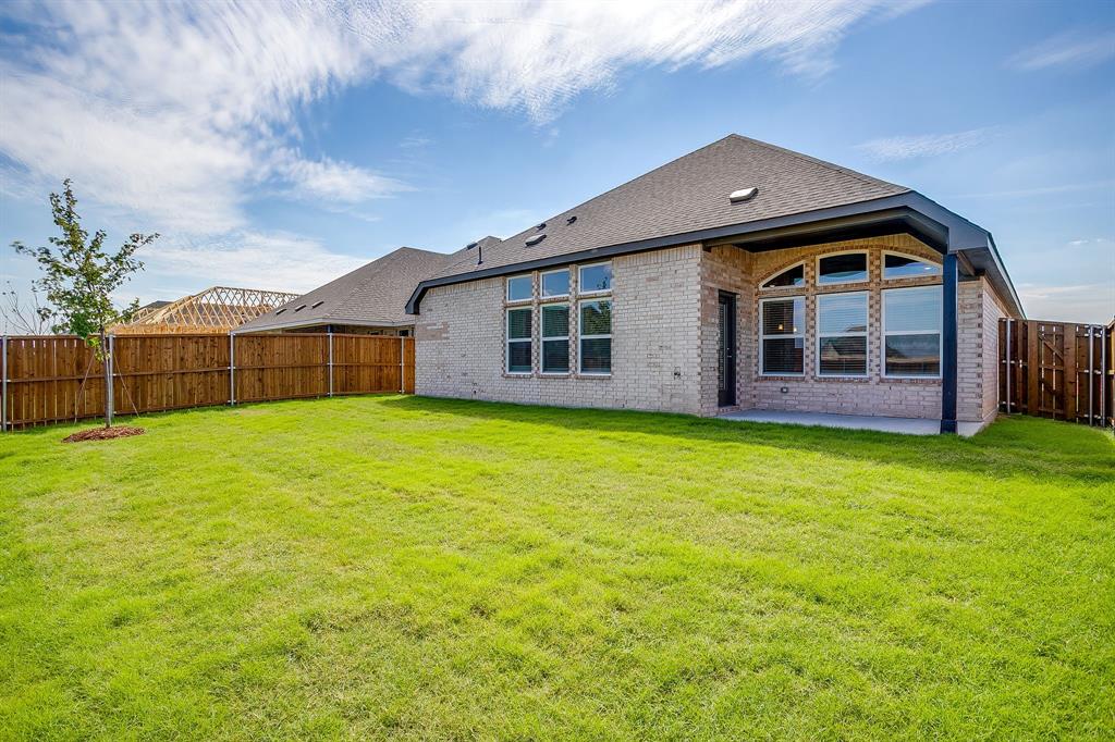 909 Schuberts Road Justin, TX 76247 - Photo 32 of 34 a front view of house with yard