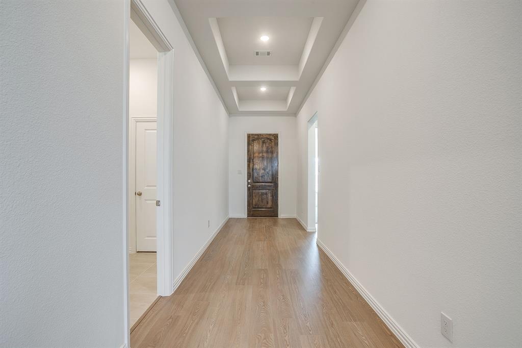 909 Schuberts Road Justin, TX 76247 - Photo 4 of 34 a view of hallway with wooden floor