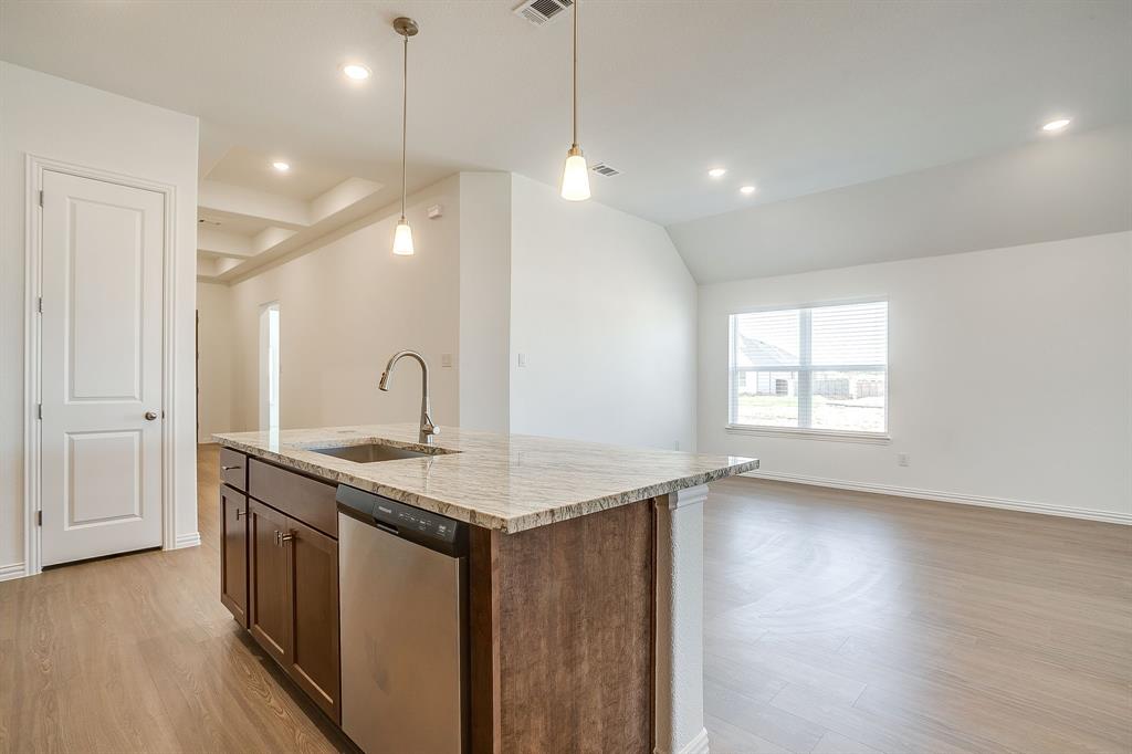 909 Schuberts Road Justin, TX 76247 - Photo 7 of 34 a kitchen with sink and window