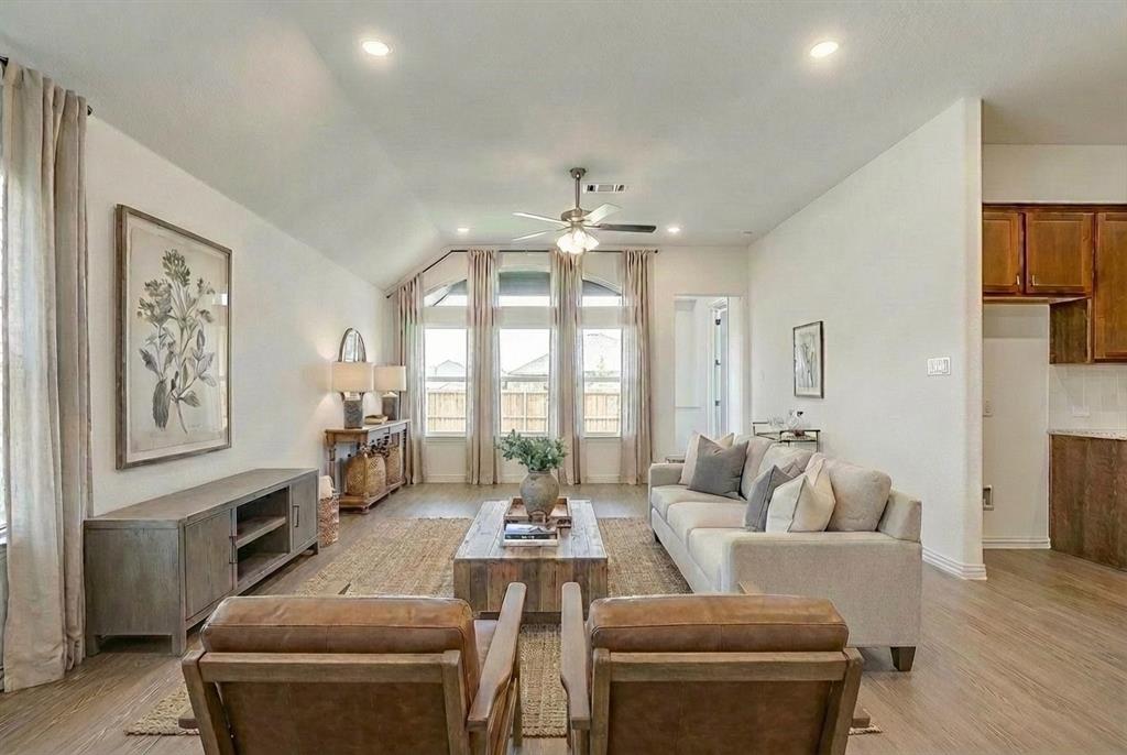 909 Schuberts Road Justin, TX 76247 - Photo 10 of 34 a living room with furniture and a large window