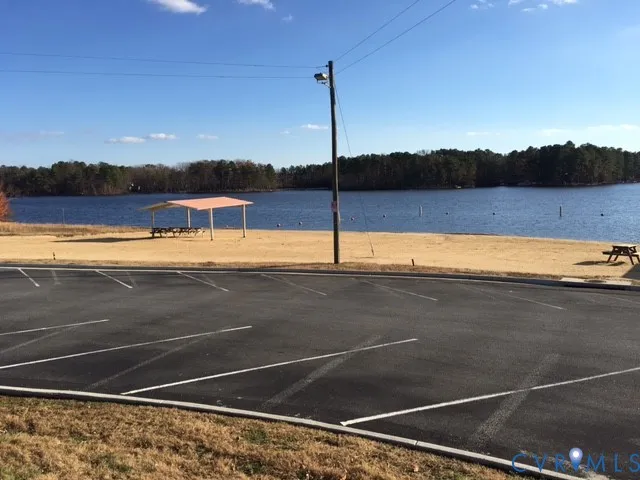 a view of a room with a floor to ceiling window and an outdoor space