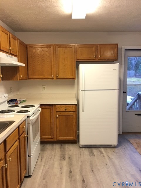 100 Hessian Drive Ruther Glen, VA 22546 - Photo 5 of 22 a kitchen with a refrigerator sink stove and cabinets
