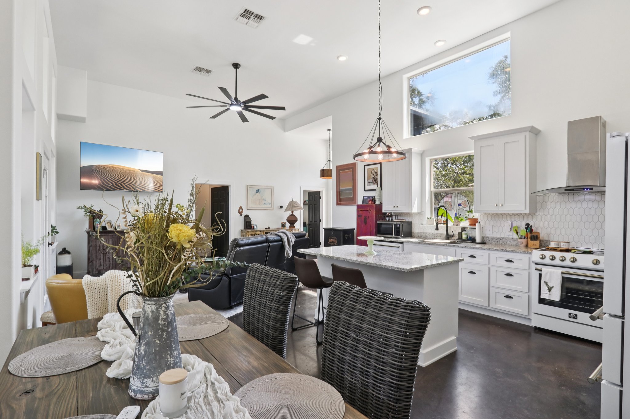 604 Wilhelm Street Bastrop, TX 78602 - Photo 37 of 39 a living room with furniture kitchen view and a chandelier