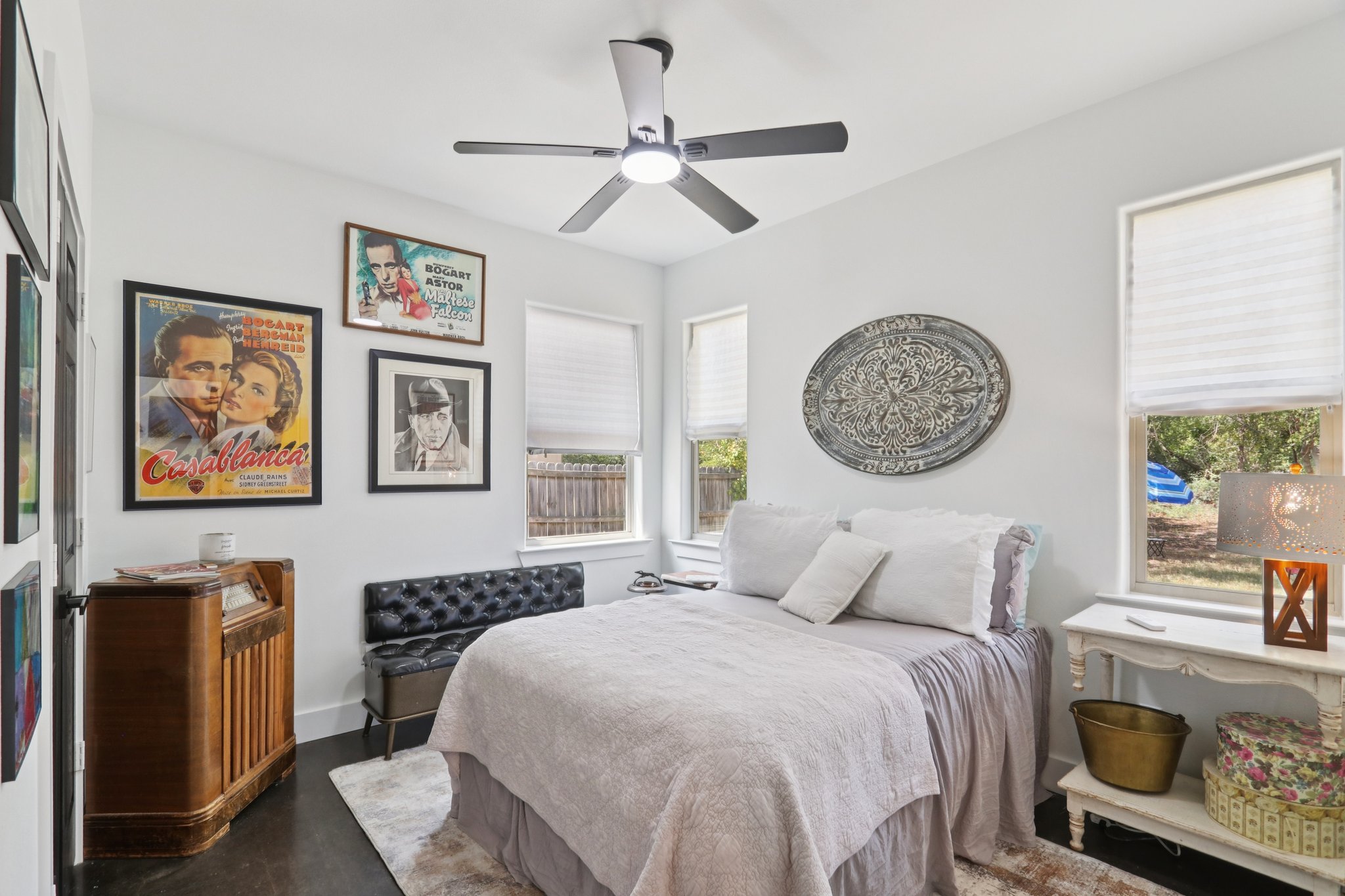 604 Wilhelm Street Bastrop, TX 78602 - Photo 25 of 39 a bedroom with a bed and a chandelier
