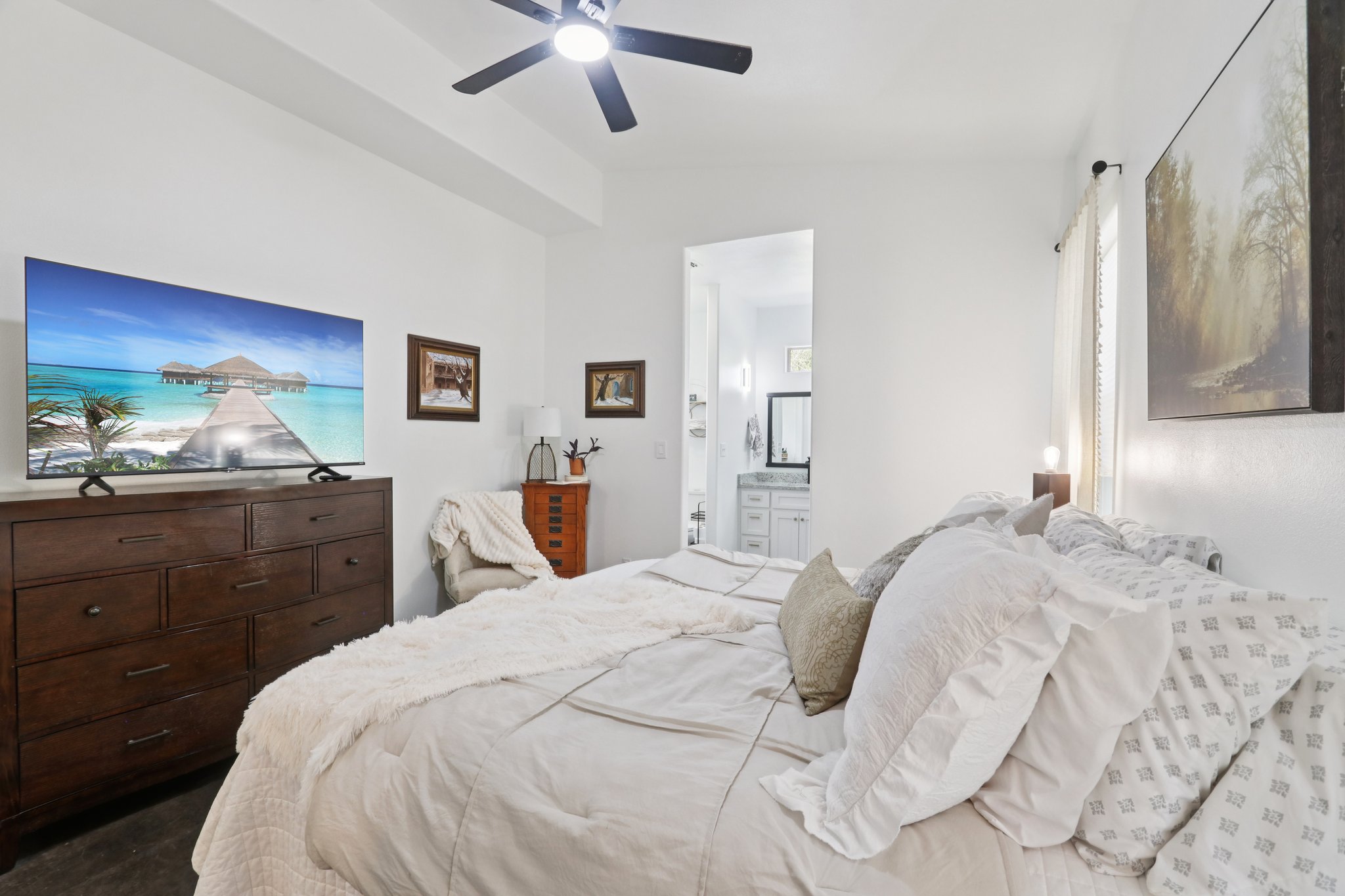 604 Wilhelm Street Bastrop, TX 78602 - Photo 2 of 39 a bedroom with a bed and a dresser