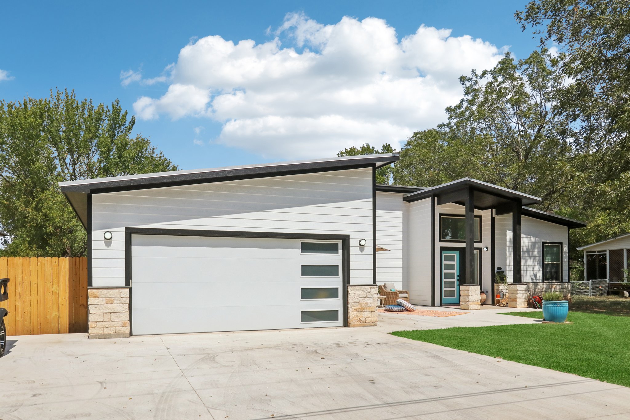 604 Wilhelm Street Bastrop, TX 78602 - Photo 6 of 39 a front view of a house with a yard and garage