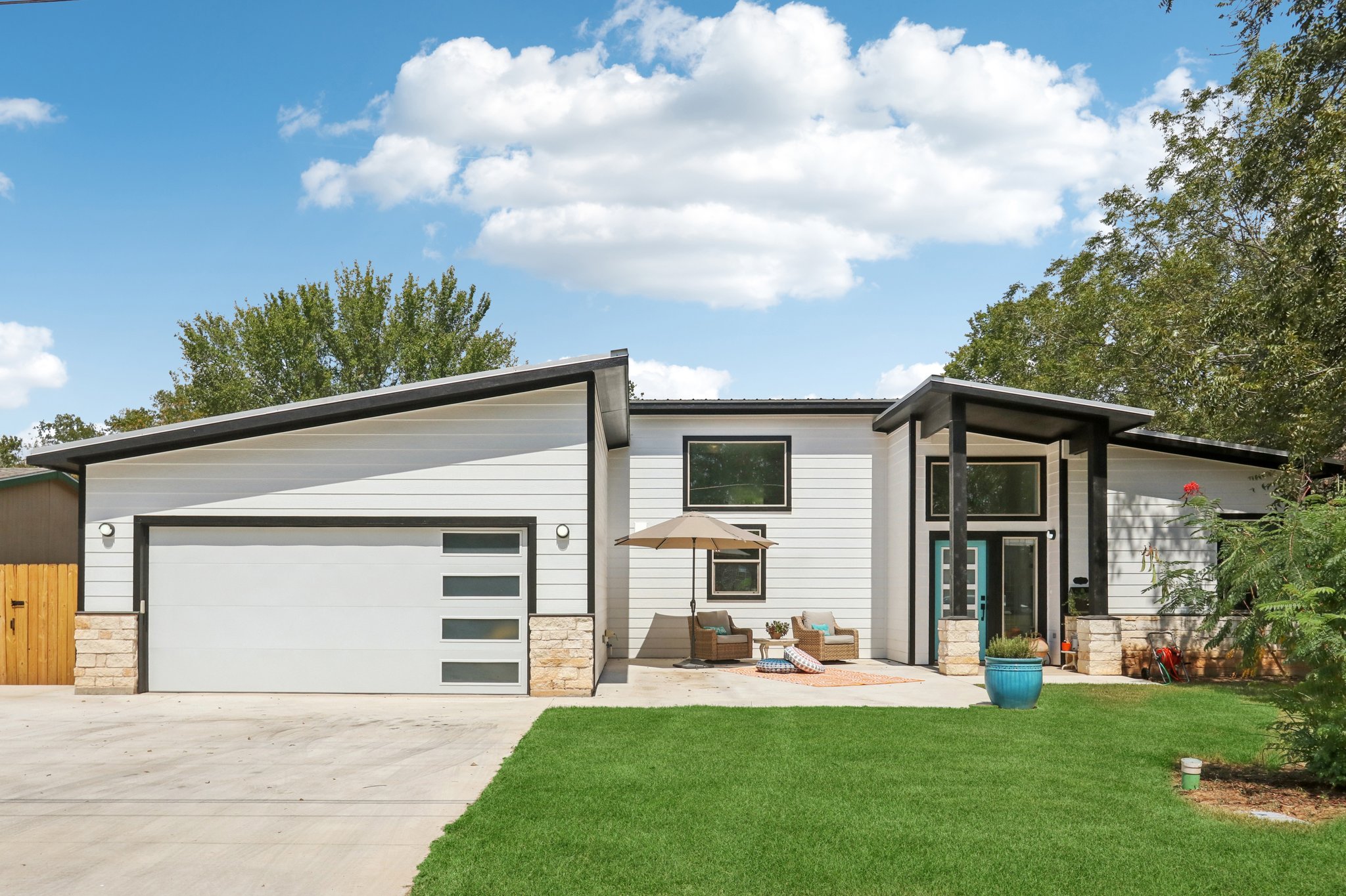 604 Wilhelm Street Bastrop, TX 78602 - Photo 7 of 39 a front view of a house with a yard and garage