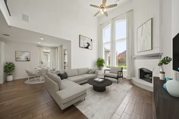 a living room with furniture fireplace and a window