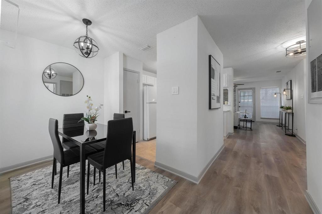 5981 Arapaho Road, Unit 305 Dallas, TX 75248 - Photo 2 of 38 a view of a dining room with furniture