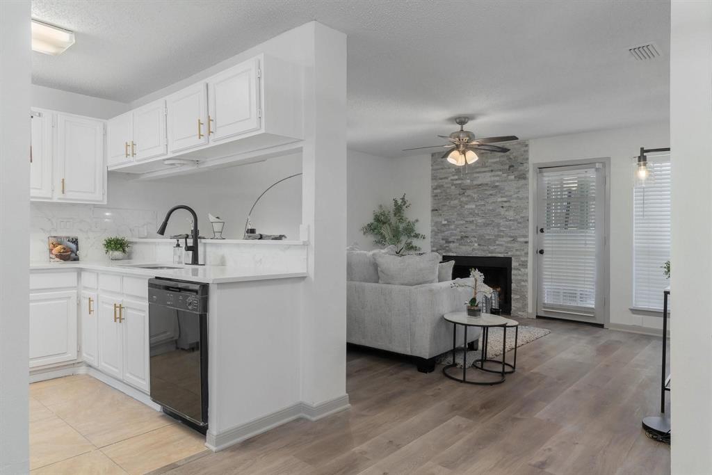 5981 Arapaho Road, Unit 305 Dallas, TX 75248 - Photo 8 of 38 a kitchen with a sink cabinets and appliances