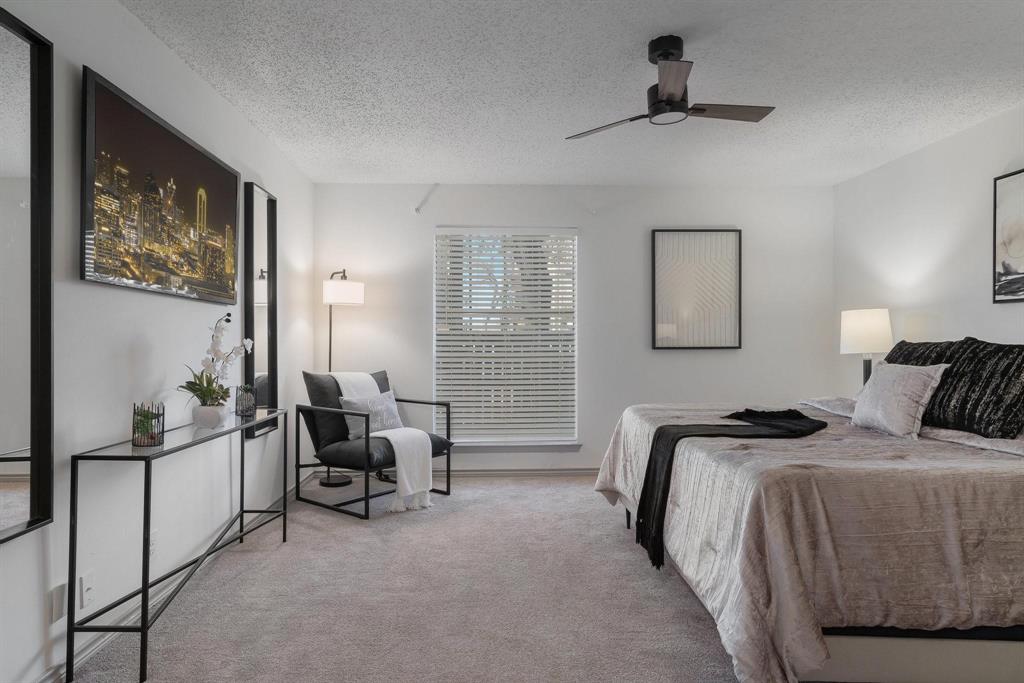 5981 Arapaho Road, Unit 305 Dallas, TX 75248 - Photo 10 of 38 a bedroom with bed and furniture