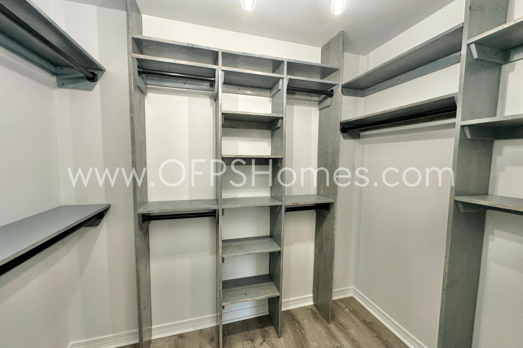 2426 Houston Circle Gulf Breeze, FL 32563 - Photo 16 of 25 a view of walk in closet with empty racks