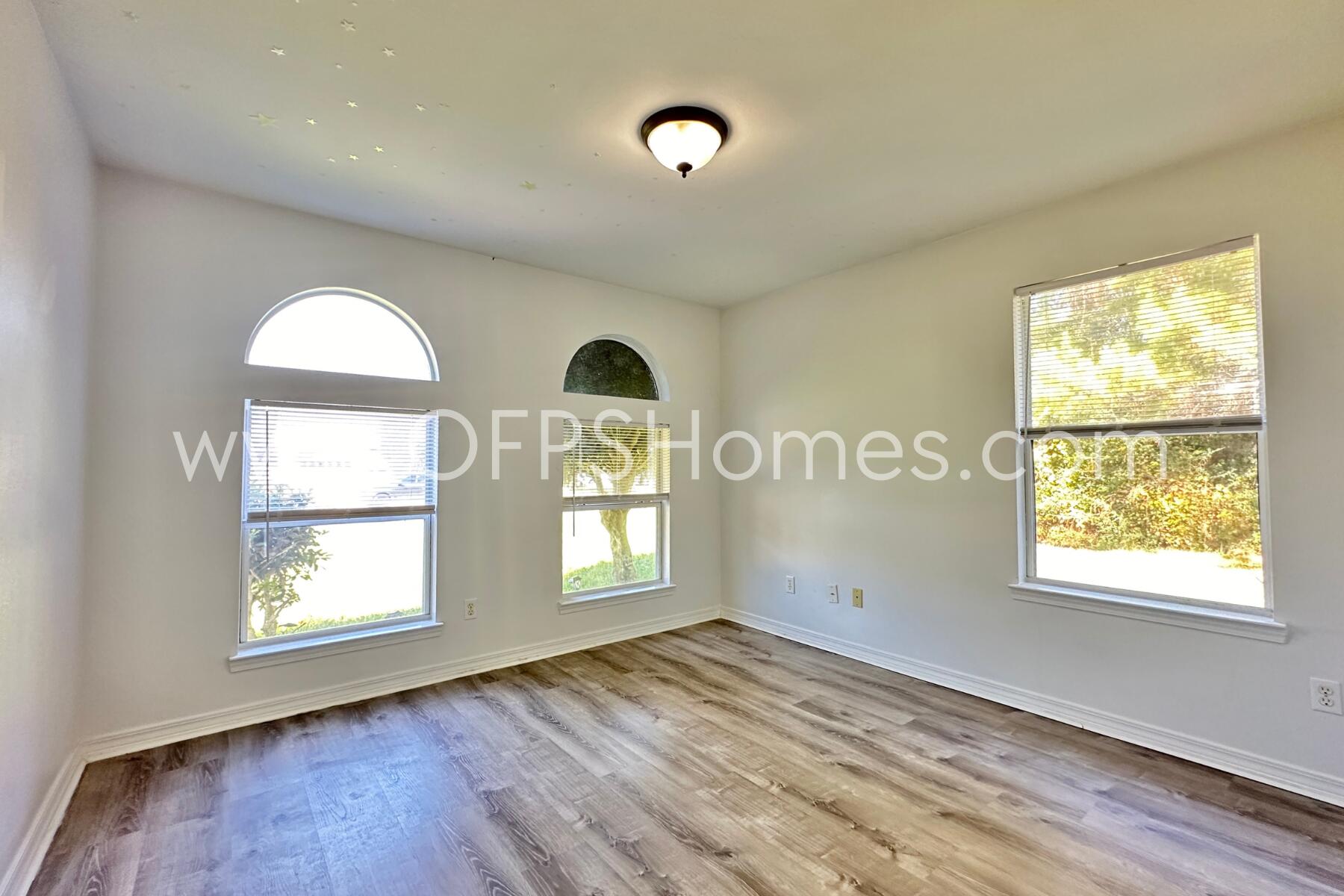 2426 Houston Circle Gulf Breeze, FL 32563 - Photo 23 of 25 a view of room window and wooden floor
