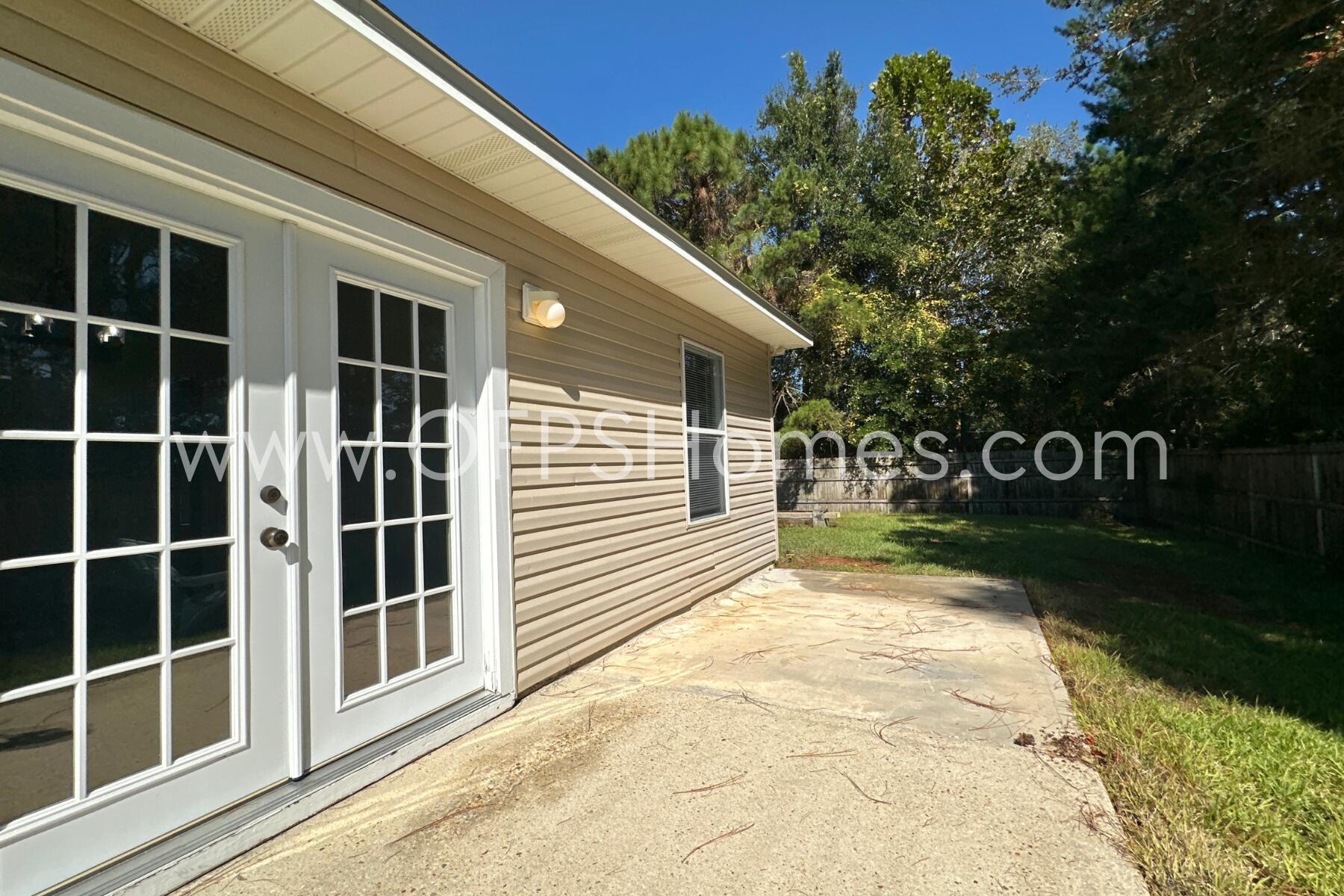 2426 Houston Circle Gulf Breeze, FL 32563 - Photo 24 of 25 a view of a house with a yard