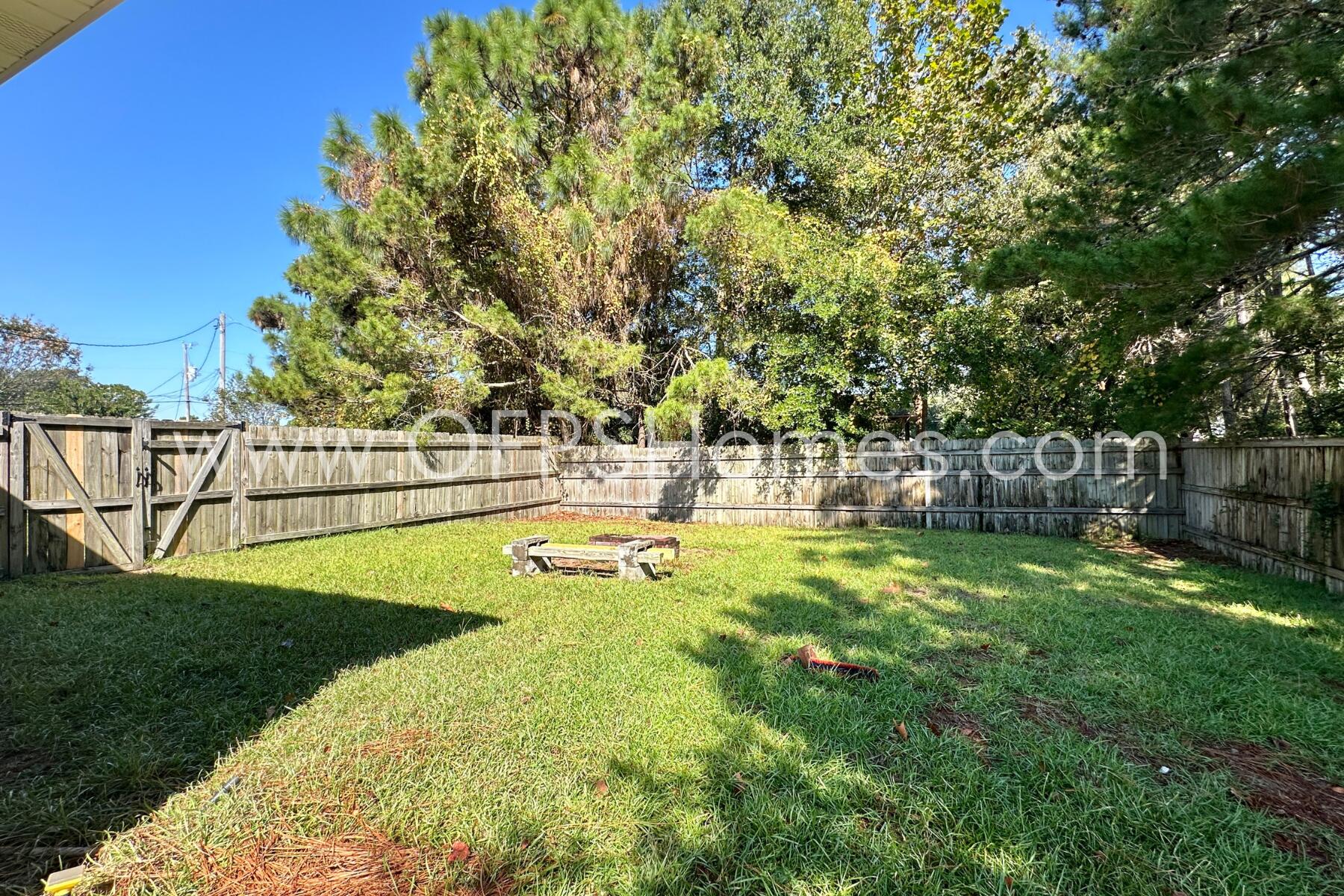 2426 Houston Circle Gulf Breeze, FL 32563 - Photo 25 of 25 a view of a swimming pool with a garden