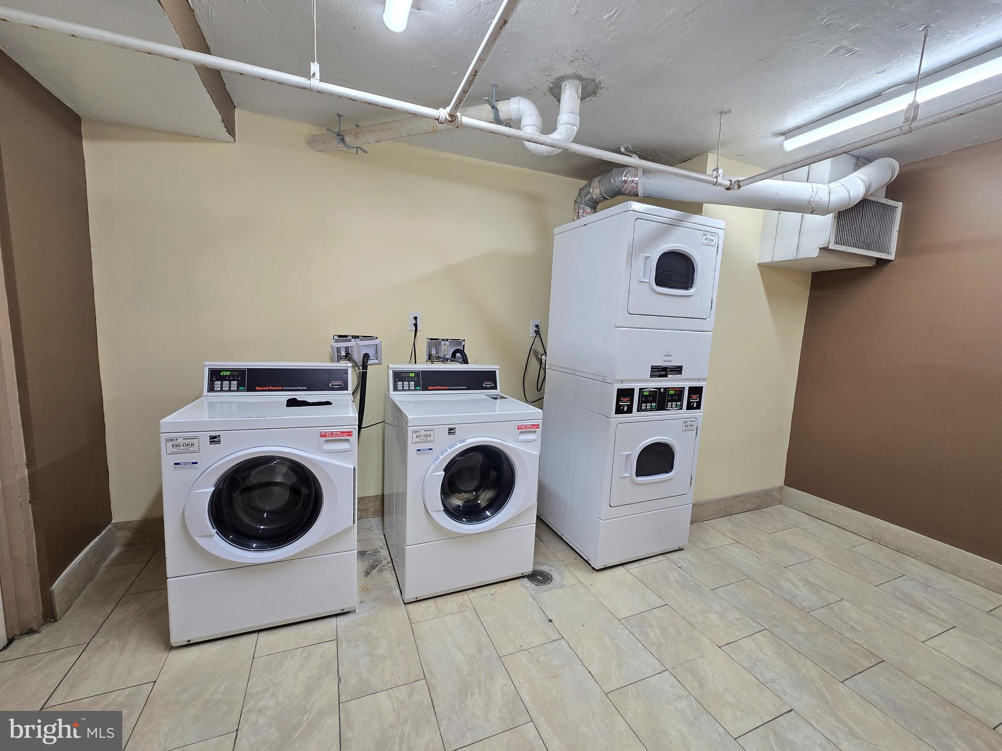 1836 Metzerott Road, Unit 1524 Hyattsville, MD 20783 - Photo 22 of 22 a utility room with dryer and washer