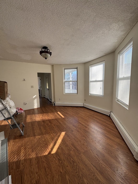 98 Lafayette Park, Unit 2 Lynn, MA 01902 - Photo 6 of 18 a bed room with a bed and a window