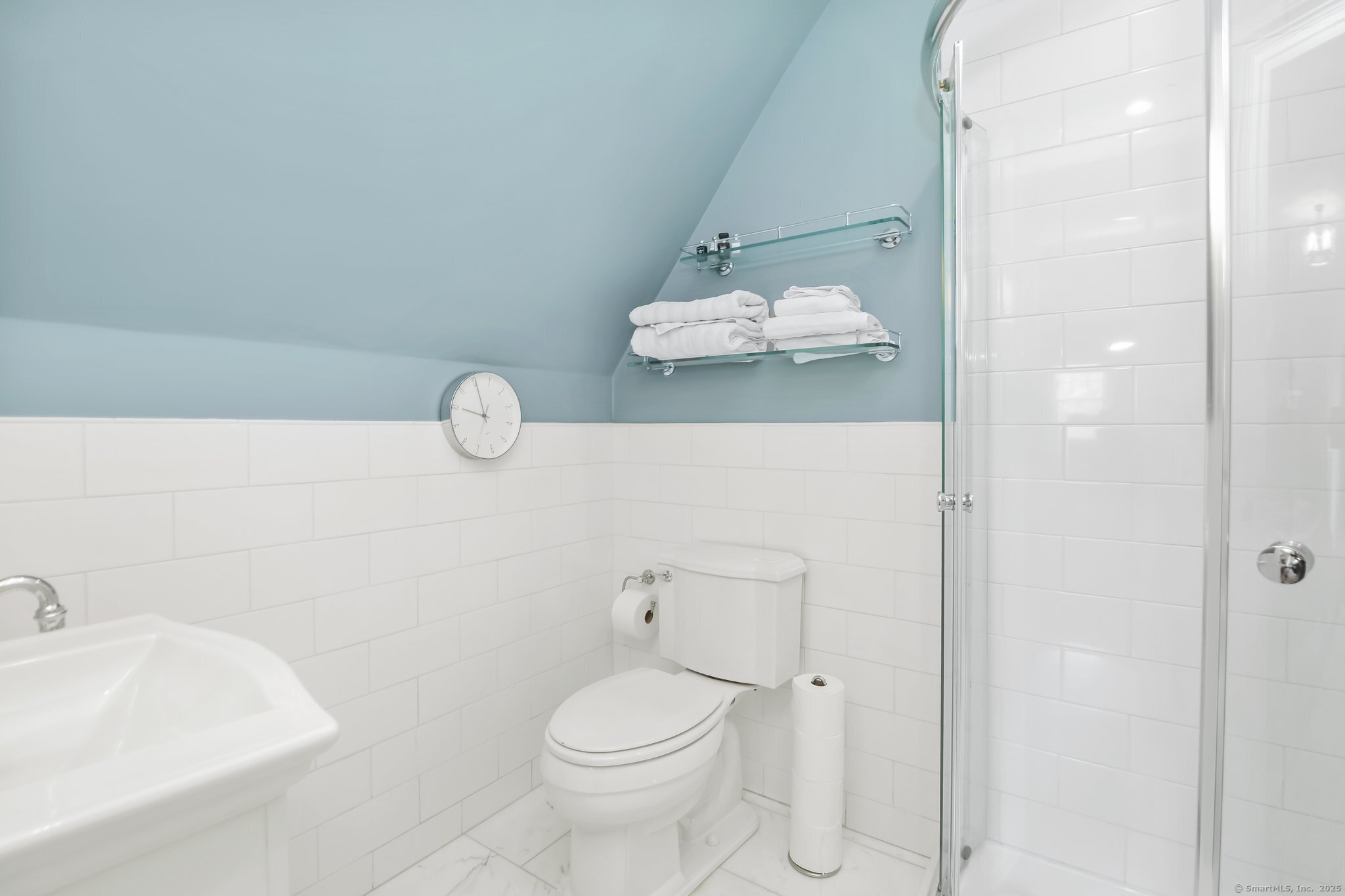 11 Old Hill Road Westport, CT 06880 - Photo 22 of 34 a bathroom with a sink a toilet and shower