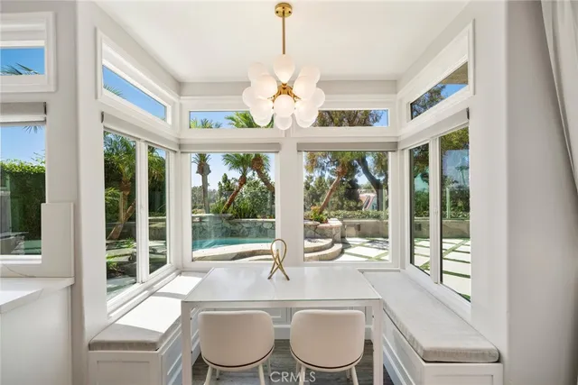 a large white kitchen with a large window