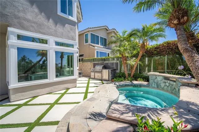 a bedroom with a bed a large window and flat screen tv