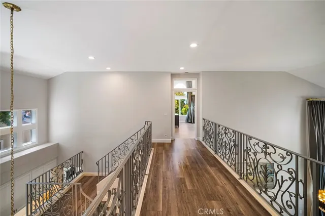 a bedroom with a large bed and a flat screen tv