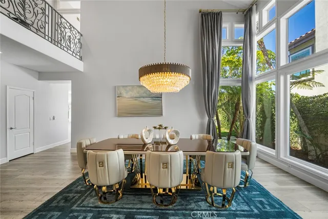 a dining room with furniture a rug and wooden floor
