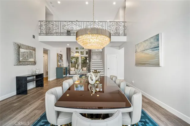 a dining room with a table and chairs