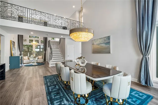 a dining room with furniture and a chandelier
