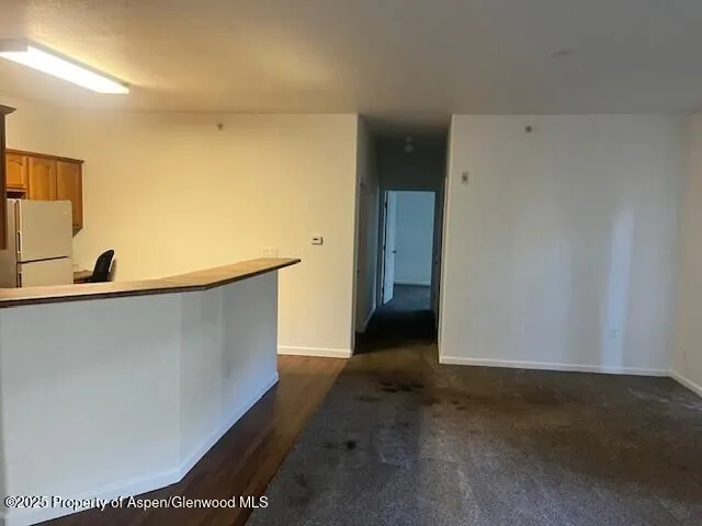 a view of a room with a wooden floor