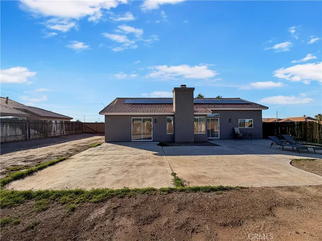 a house view with a backyard space