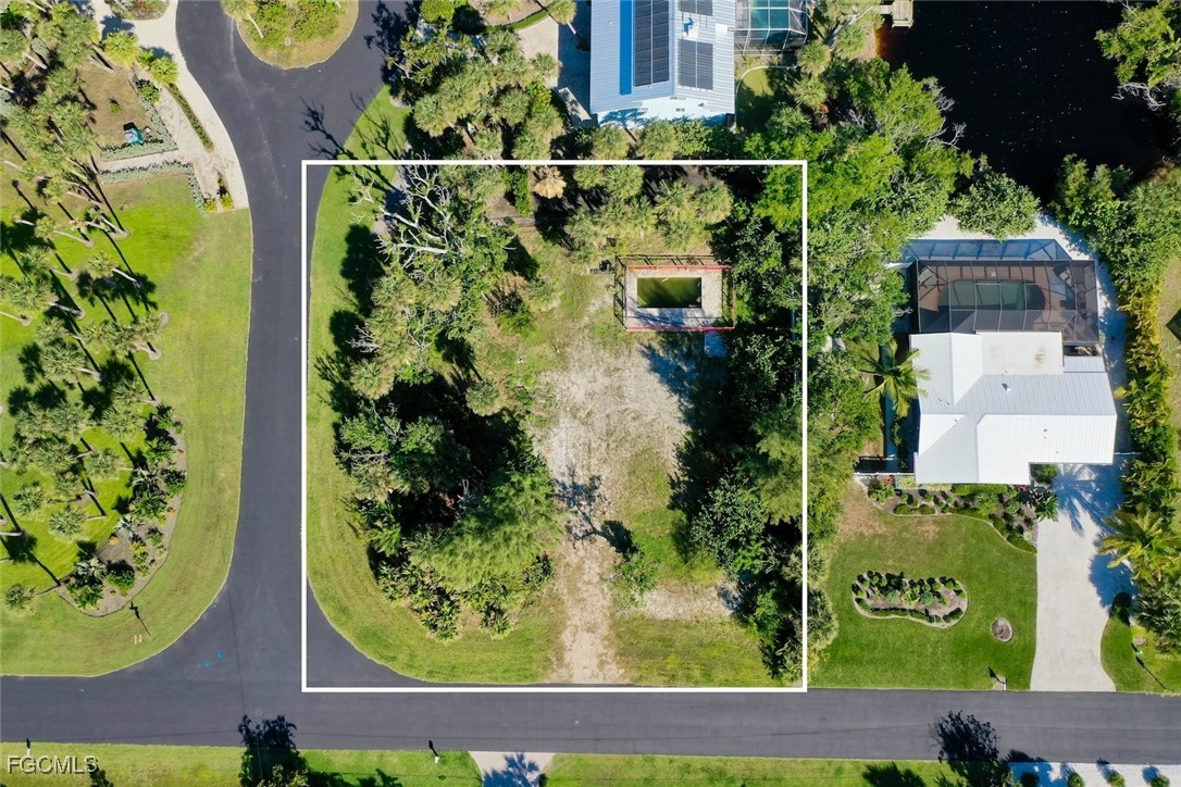 1653 Bunting Lane Sanibel, FL 33957 - Photo 12 of 12 an aerial view of a residential houses with yard