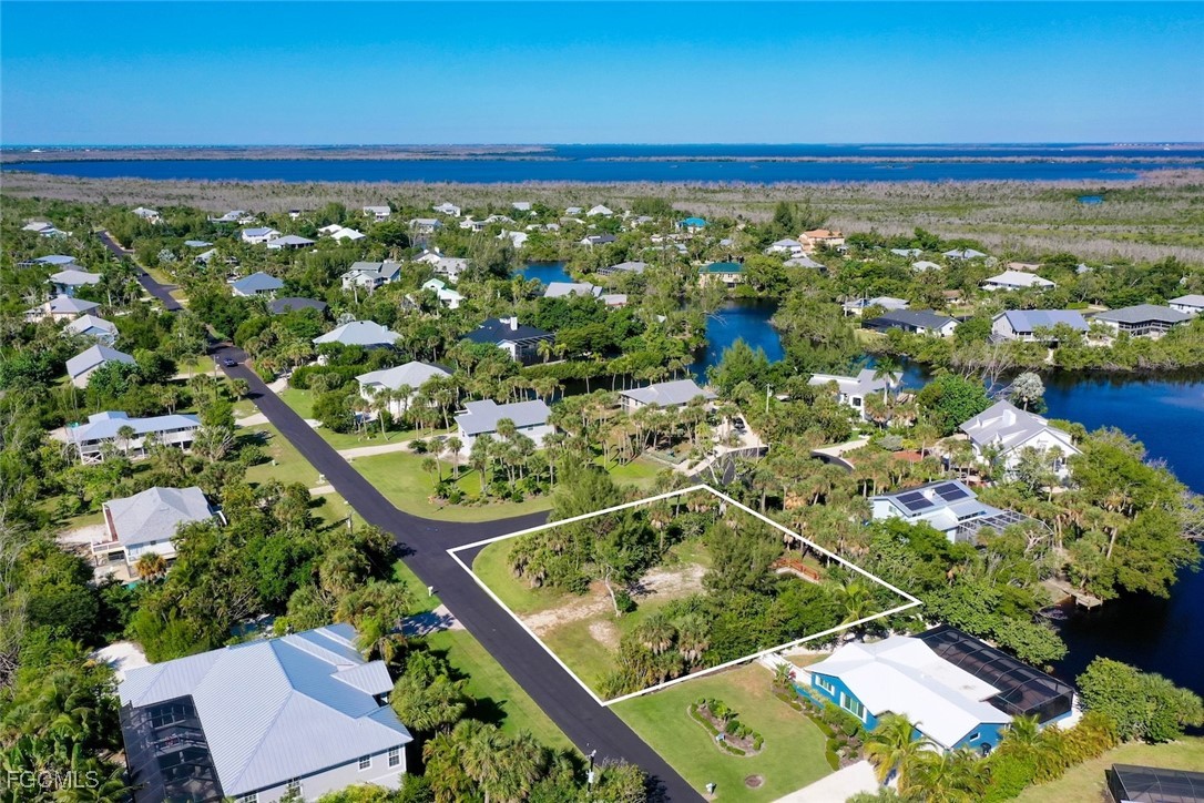 1653 Bunting Lane Sanibel, FL 33957 - Photo 3 of 12 an aerial view of a residential houses with outdoor space and trees