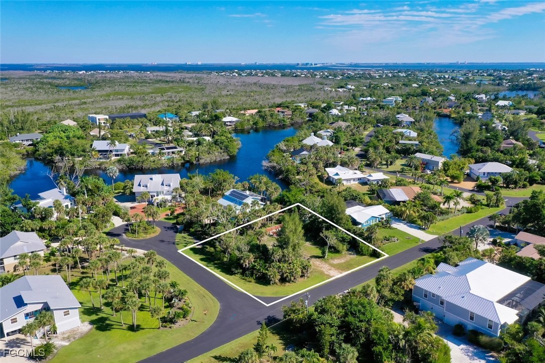 1653 Bunting Lane Sanibel, FL 33957 - Photo 5 of 12 a view of a city with lots of residential buildings ocean and mountain view in back