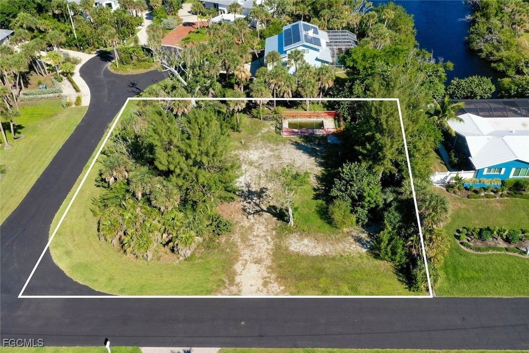 1653 Bunting Lane Sanibel, FL 33957 - Photo 9 of 12 a view of swimming pool from a window