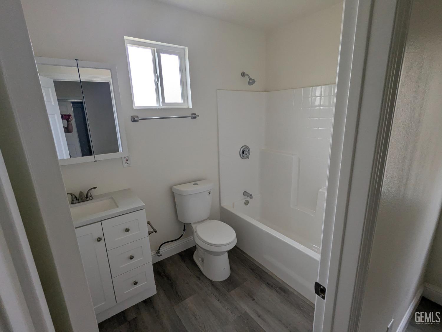 Undisclosed Address Bakersfield, CA 93307 - Photo 13 of 17 a bathroom with a toilet and a sink