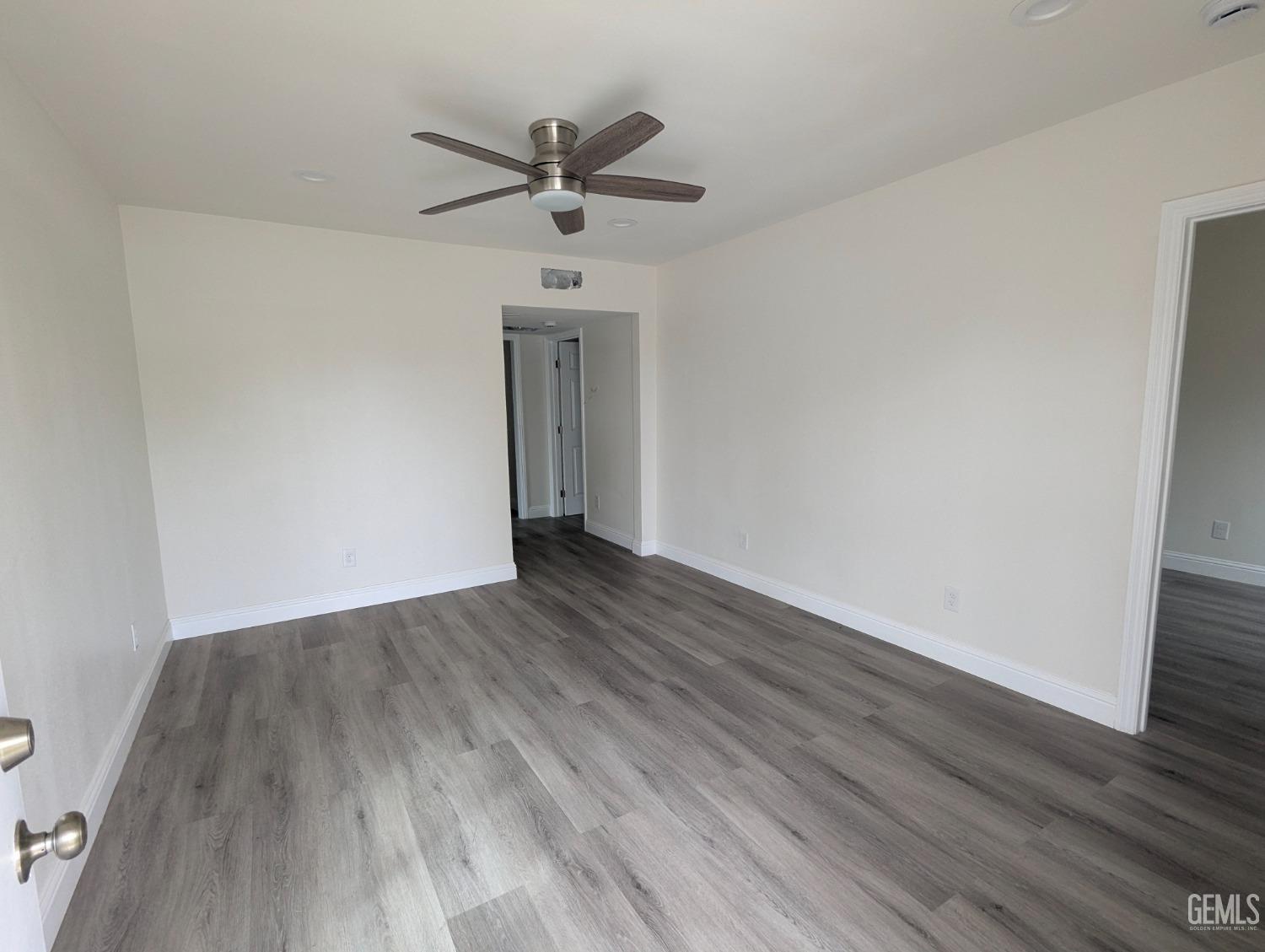 Undisclosed Address Bakersfield, CA 93307 - Photo 17 of 17 wooden floor in an empty room