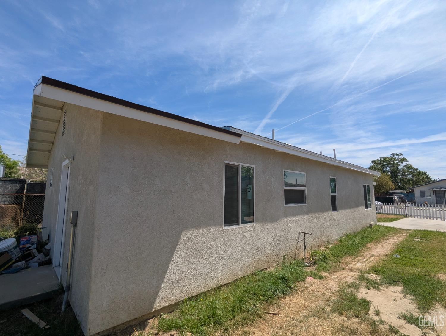 Undisclosed Address Bakersfield, CA 93307 - Photo 6 of 17 a house view with a backyard space