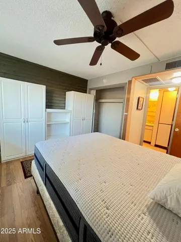 a room with a bed and a chandelier