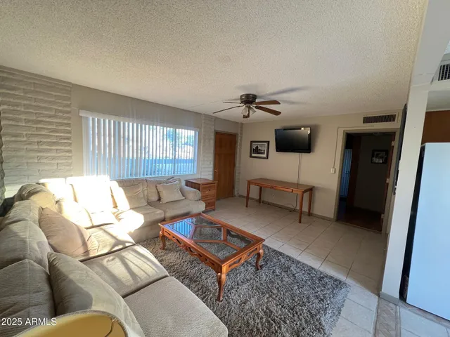 a living room with furniture and a rug