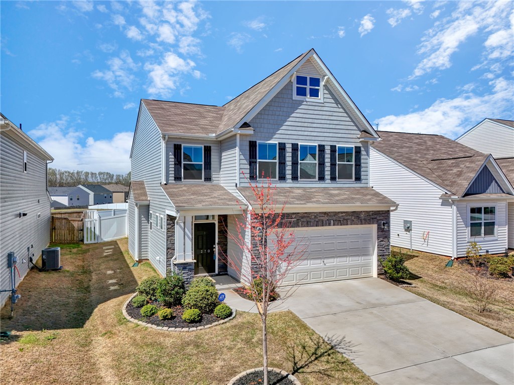 270 Pendergast Road Greenville, SC 29605 - Photo 1 of 43 A welcoming facade with a stone-accented garage and landscaped entry invites you into this charming home.