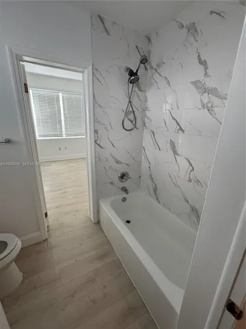 an empty room with a empty space and windows