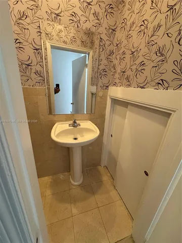a bathroom with a toilet and a sink