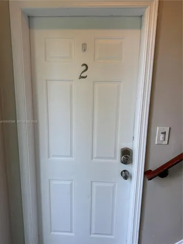 a kitchen with stainless steel appliances a stove a sink and a refrigerator